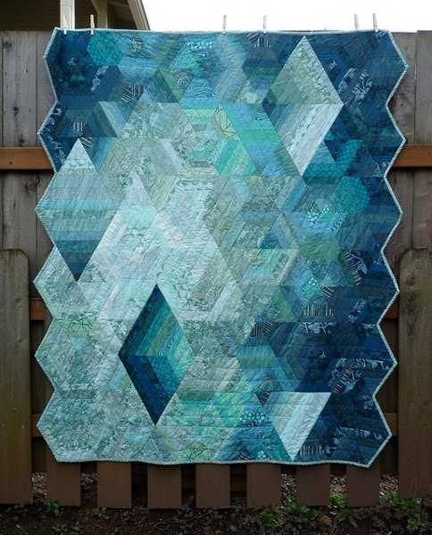 blue quilt with geometric pattern
