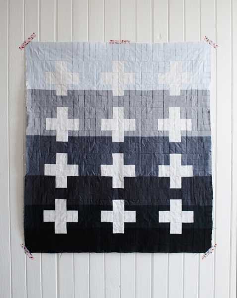 back and white blanket with crosses
