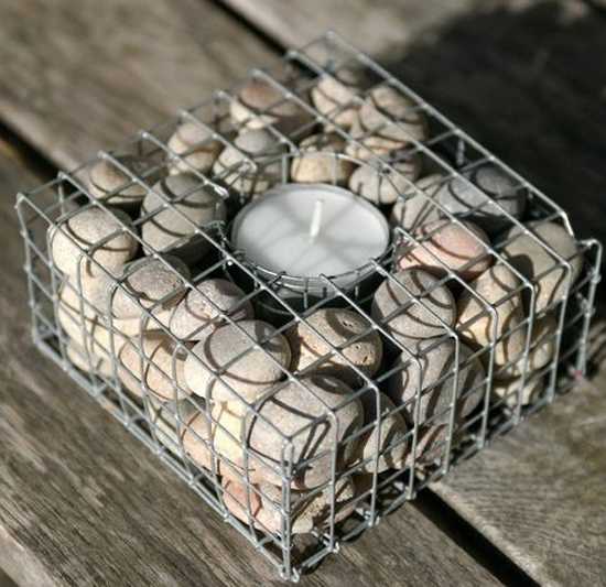 unusual candle centerpiece with beach pebbles