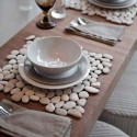 created placemats with white pebbles