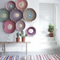 white wall decoration with colorful basket shells