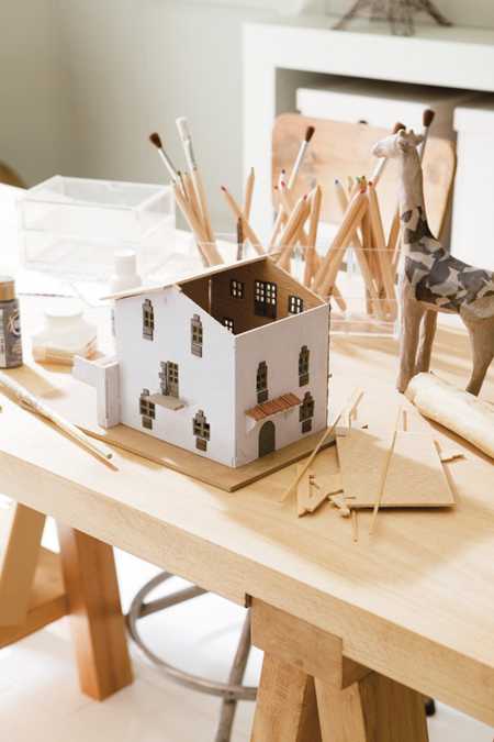 Kids activity table with small house model