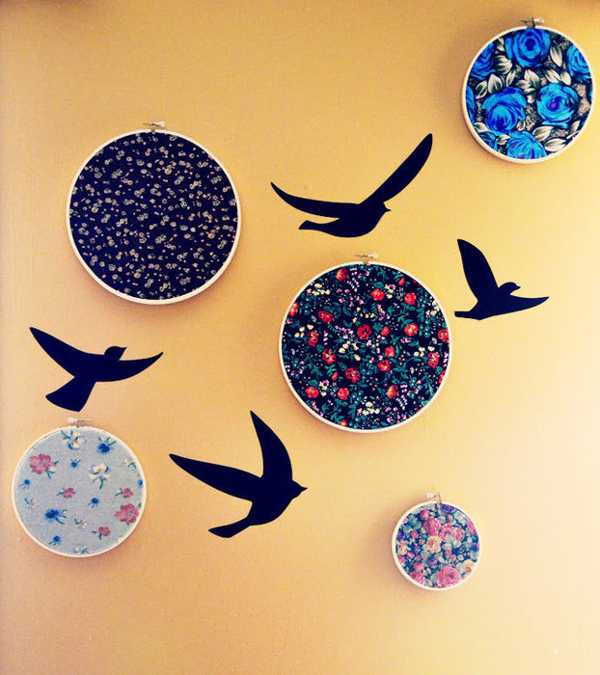 Wall decoration with wooden embroidery hoops and bird images