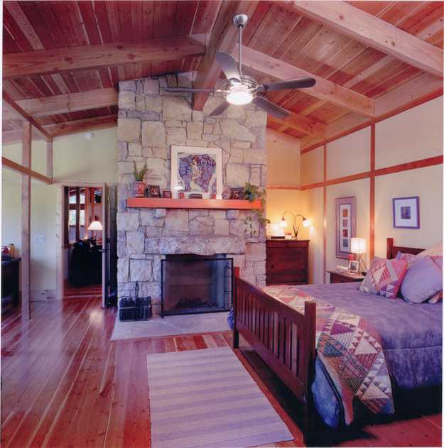 country-style bedroom with a fireplace, bedroom decorating ideas