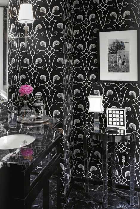  black and white bathroom design with clear plastic table and pink flower arrangement 