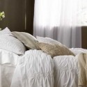 bedding set in light, neutral colors