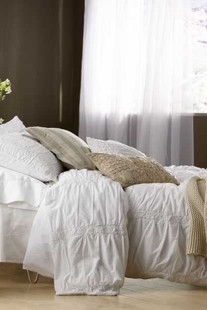 bedding set in light, neutral colors