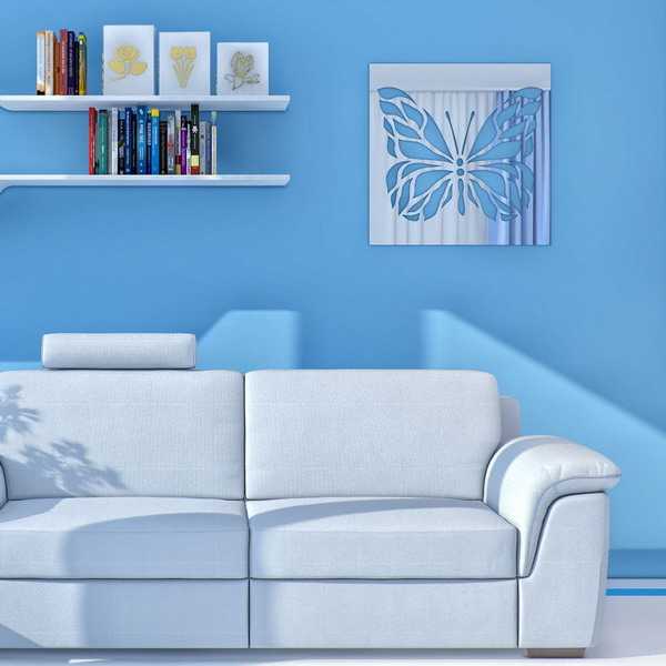 wall mirror with cut design on the blue wall