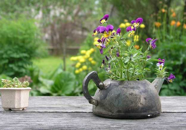 metal kettle with flowers