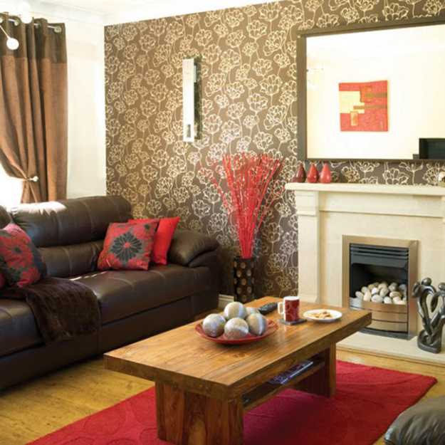 red carpet and pillows in the living room with furniture and wallpaper in brown color