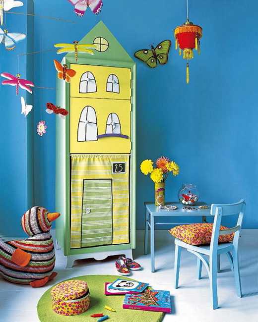 Children room decoration with blue wall color and painted wooden furniture