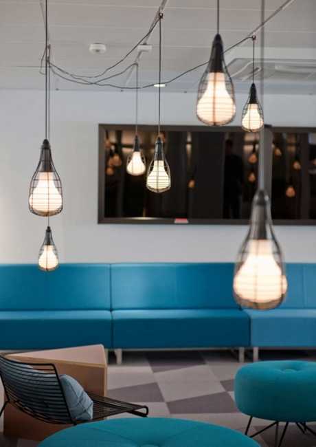 blue sofa and modern pendant lights