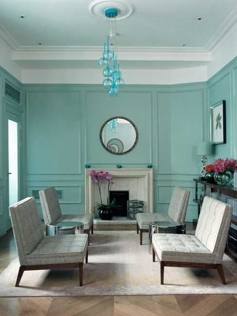 turquoise blue wall paint and white living room furniture