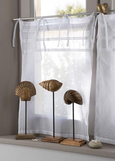 white kitchen curtain and seashell