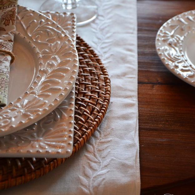 rattan placemats and white crockery