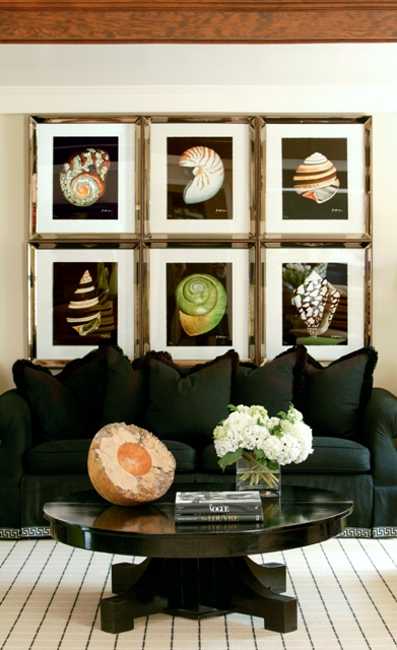 black sofa and wall decoration with posters