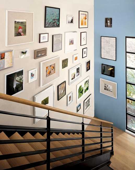 modern stair design and wall decoration with art prints and paintings