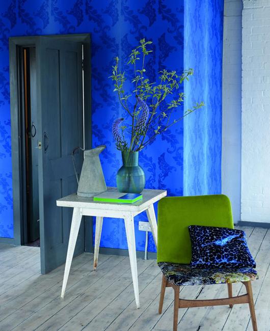 modern room decorate with beautiful wallpaper and home textiles 