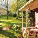 country house with stone walls and outdoor living spaces