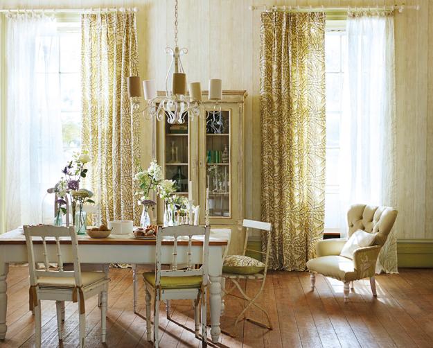 modern interior design in classic style. Pastel room colors, vintage furniture, floral wallpaper patterns and home textiles