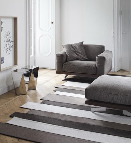 modern interior decoration with striped rugs and carpets